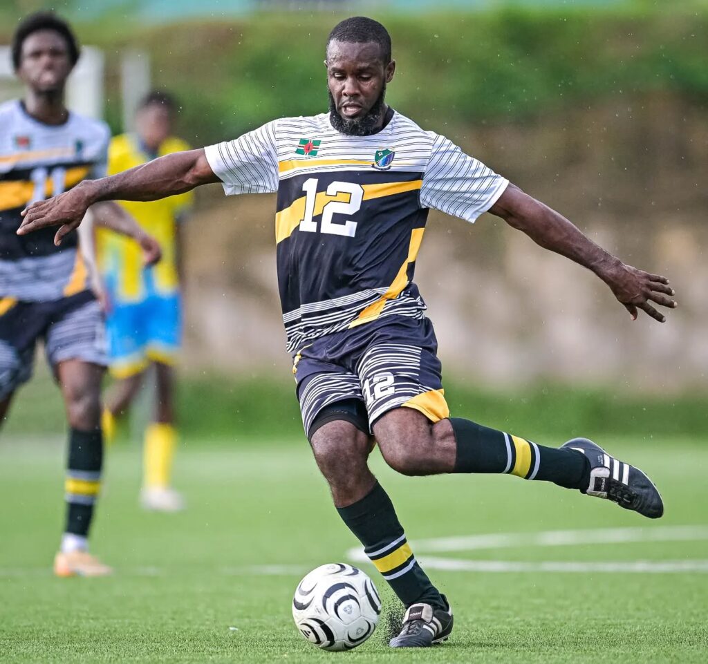 Kimon Jno. Baptiste about to pass the ball