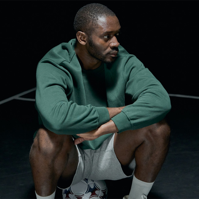 Stock photo of a player sitting on a football