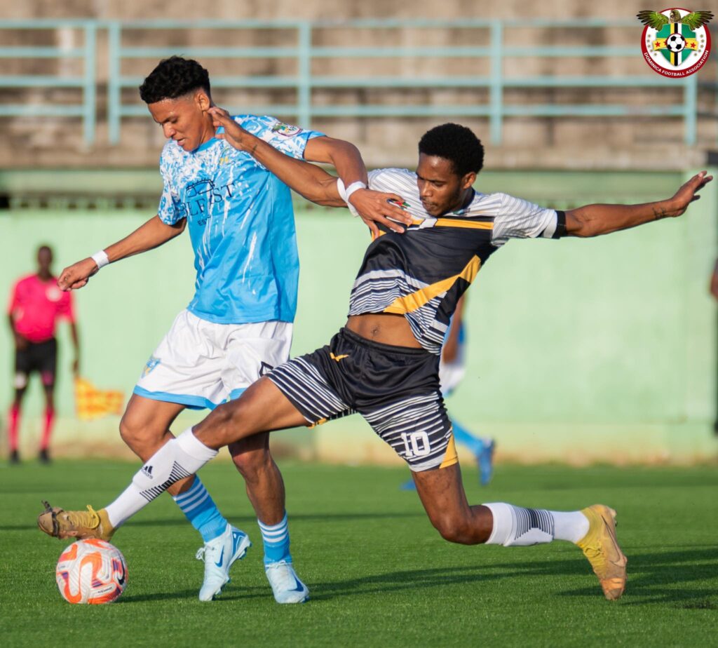 Marcelus Bonney winning the ball from a Mahaut player