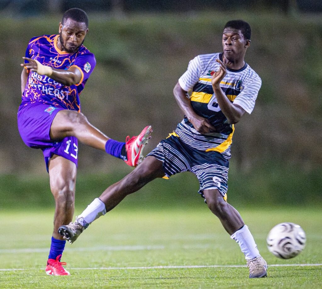 Middleham United FC player Fitzroy Benjamin attempting to block a shot from a South East FC player