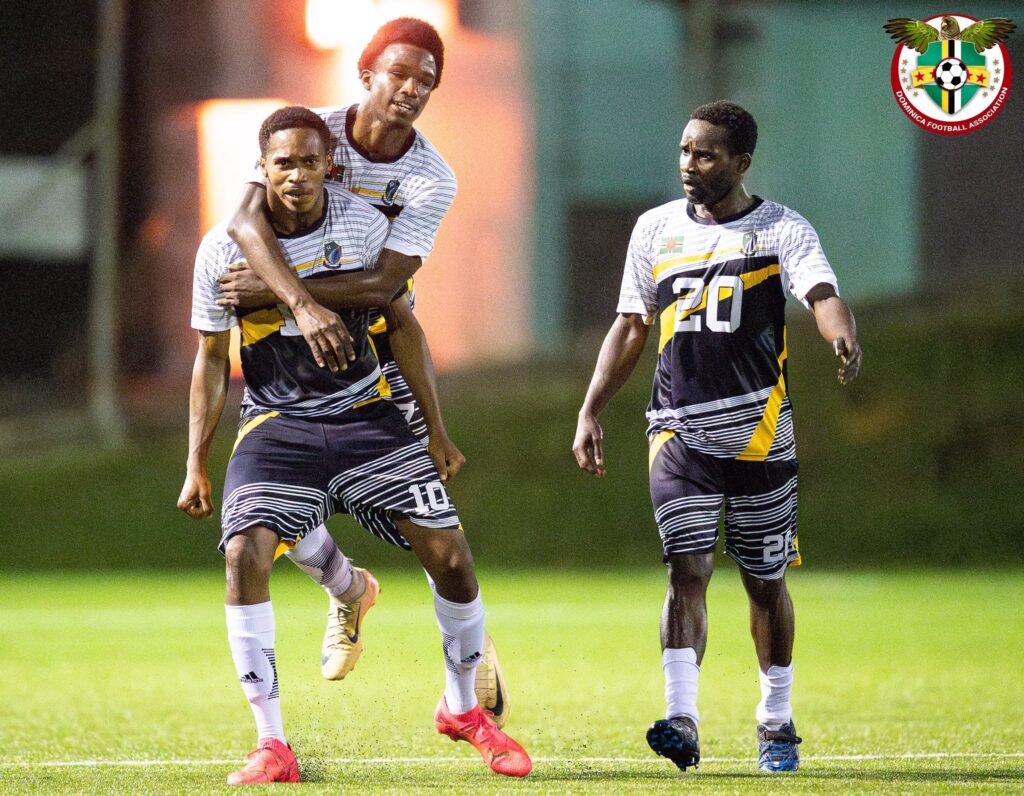 Marcellus Bonney, Josimar Gustave and Curtly Augustine celebrating a goal