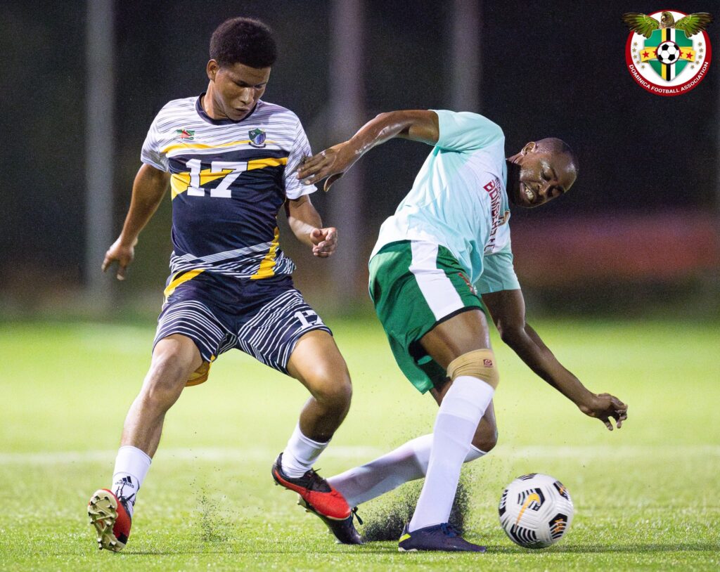 Middleham United FC player trying to win the ball from a Portsmouth Bombers FC player