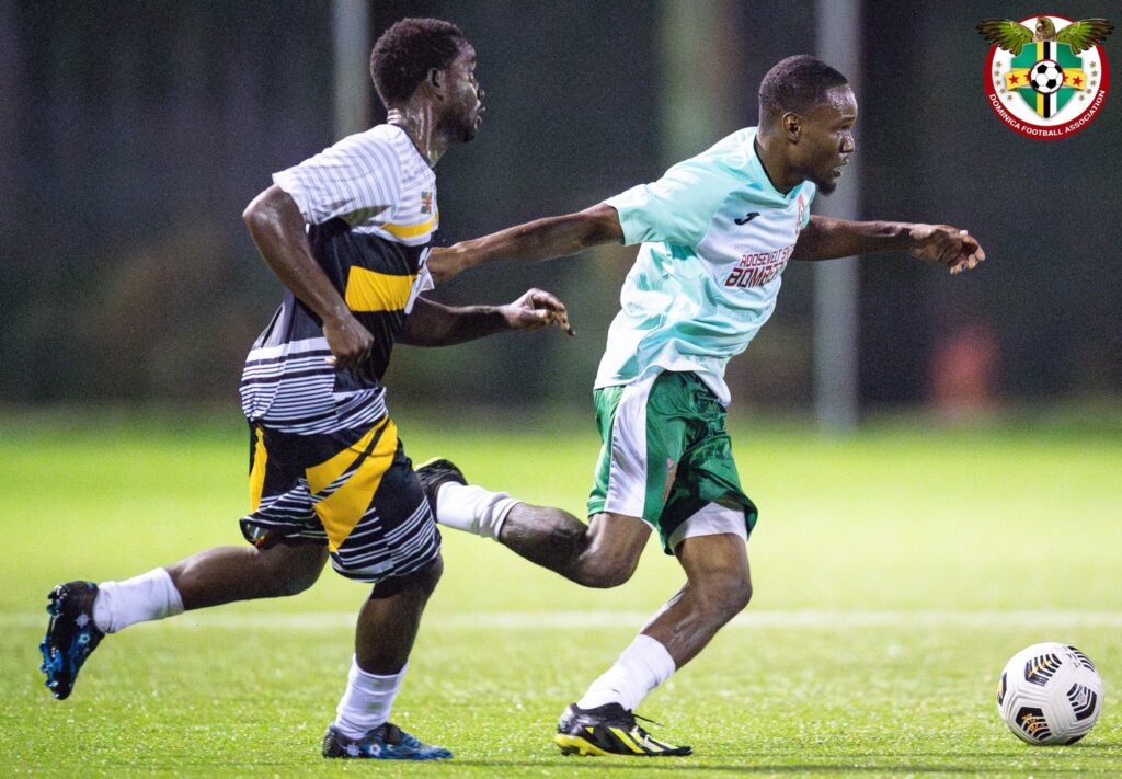 Curtly Augustine attempting to win the ball from a Portsmouth Bombers FC player