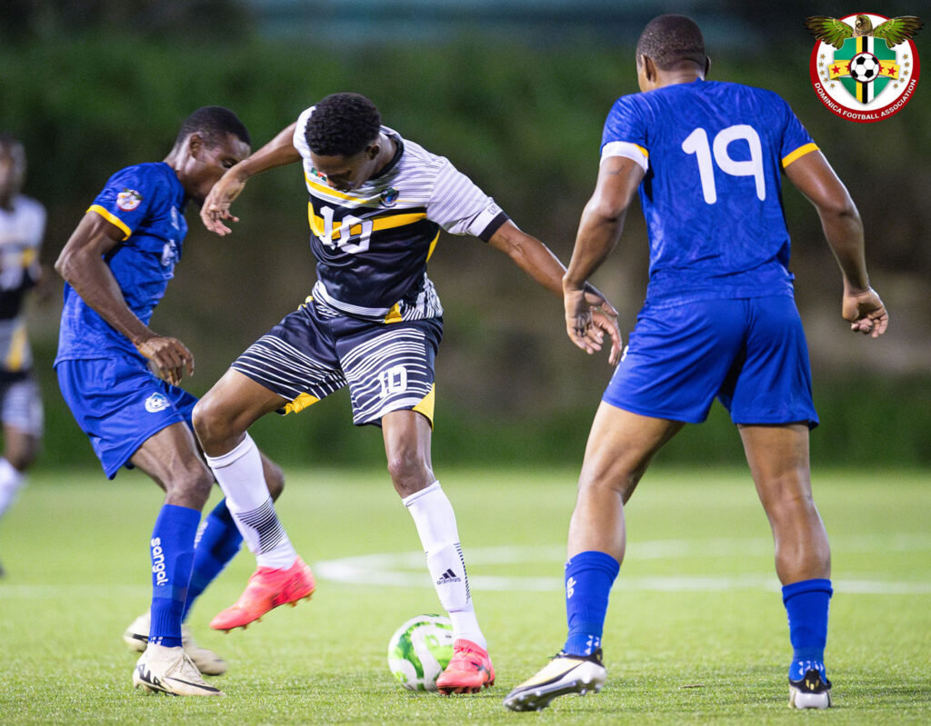 Marcellus Bonney getting a pass under control with two Dublanc players applying pressure