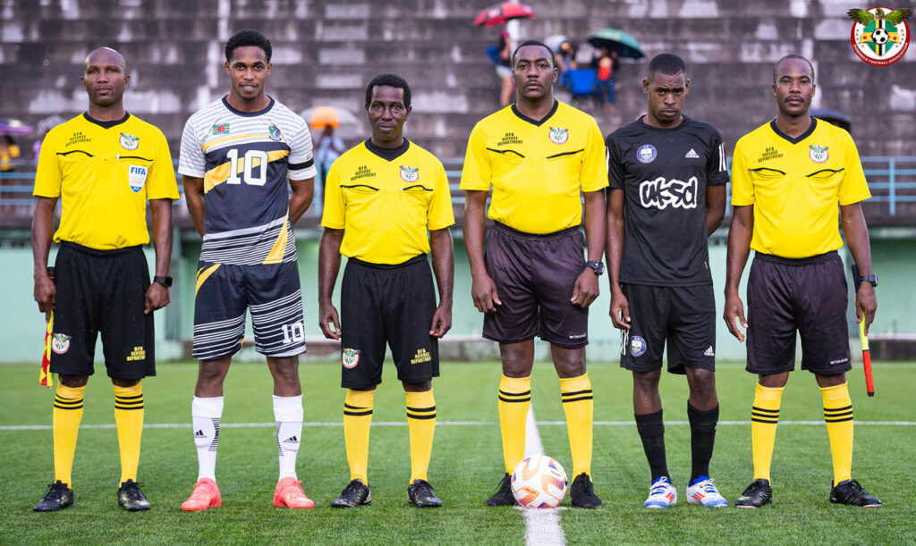 Officials and team captains posing for a photo