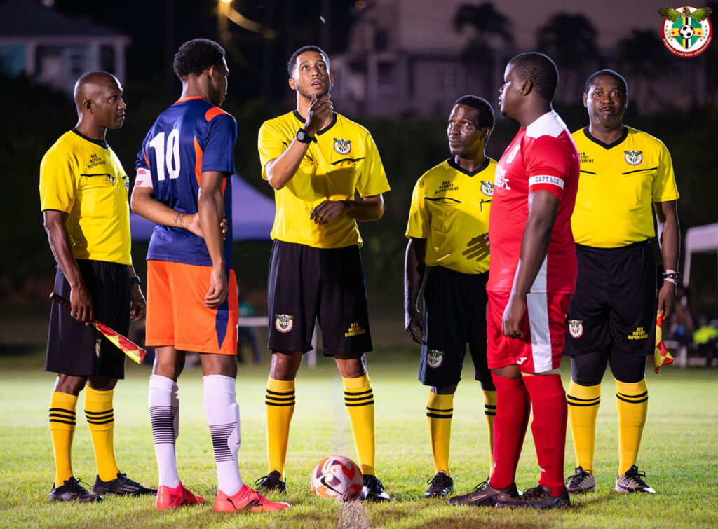 Match official tossing the coin to select sides