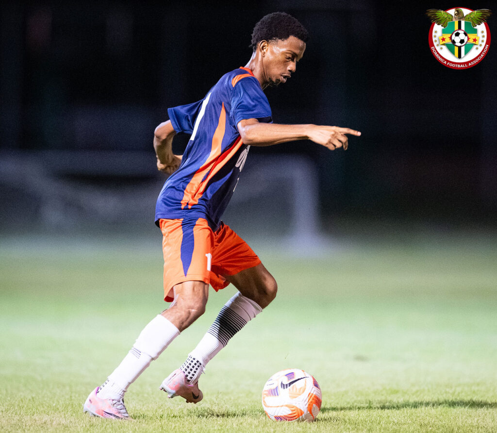 Middleham United FC player Ajani Richards dribbling in midfield