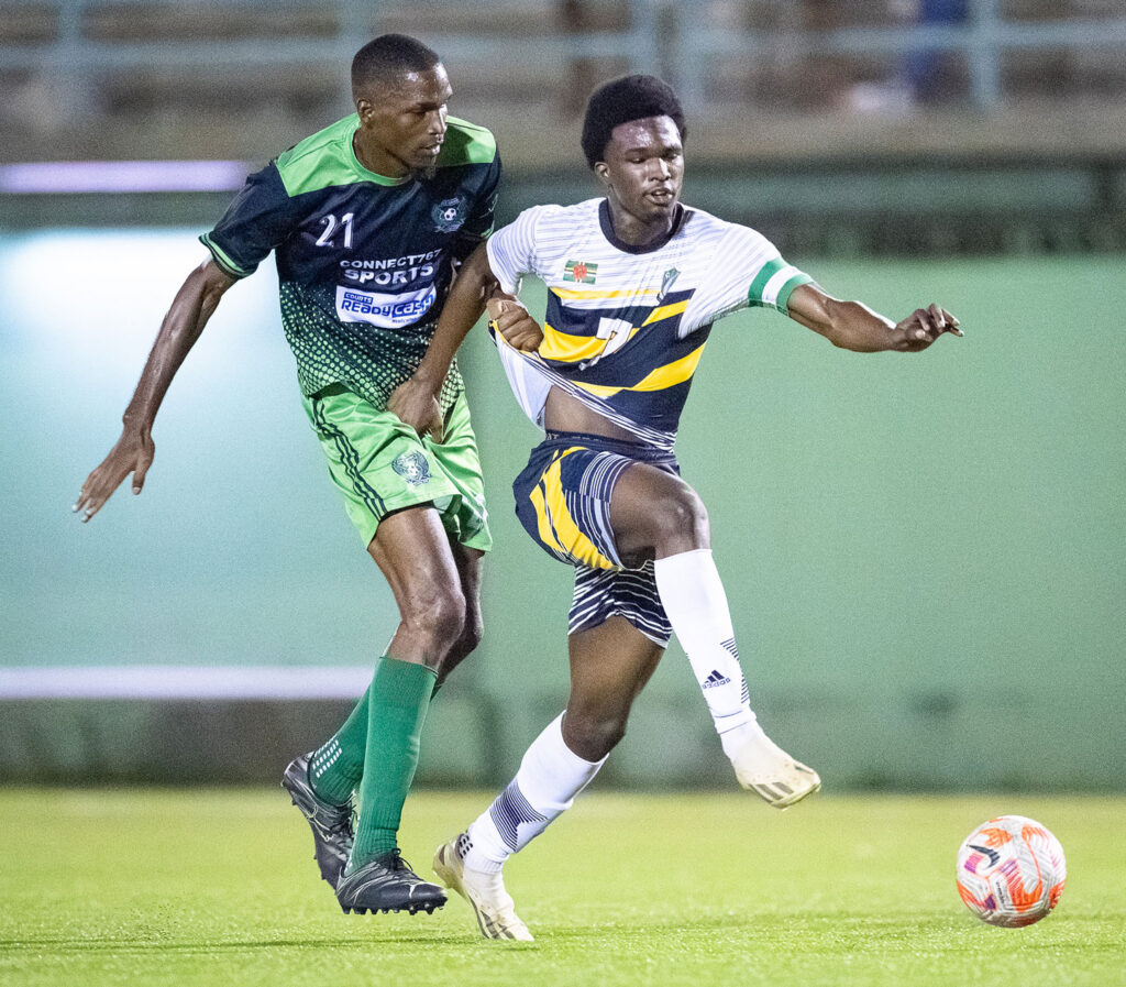Middleham United FC player Josimar Gustave literally being handled by an East Central FC player