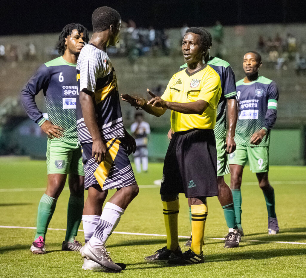 The referee getting Middleham United FC player Fitzroy Benjamin to calm down