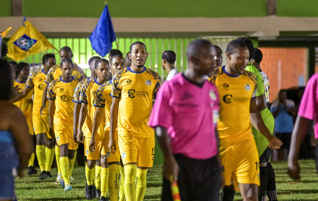 Dublanc FC walking into the field led by the referees